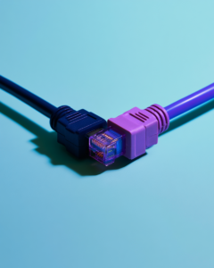 A navy and a purple network cable connector meeting end to end on a light blue background
